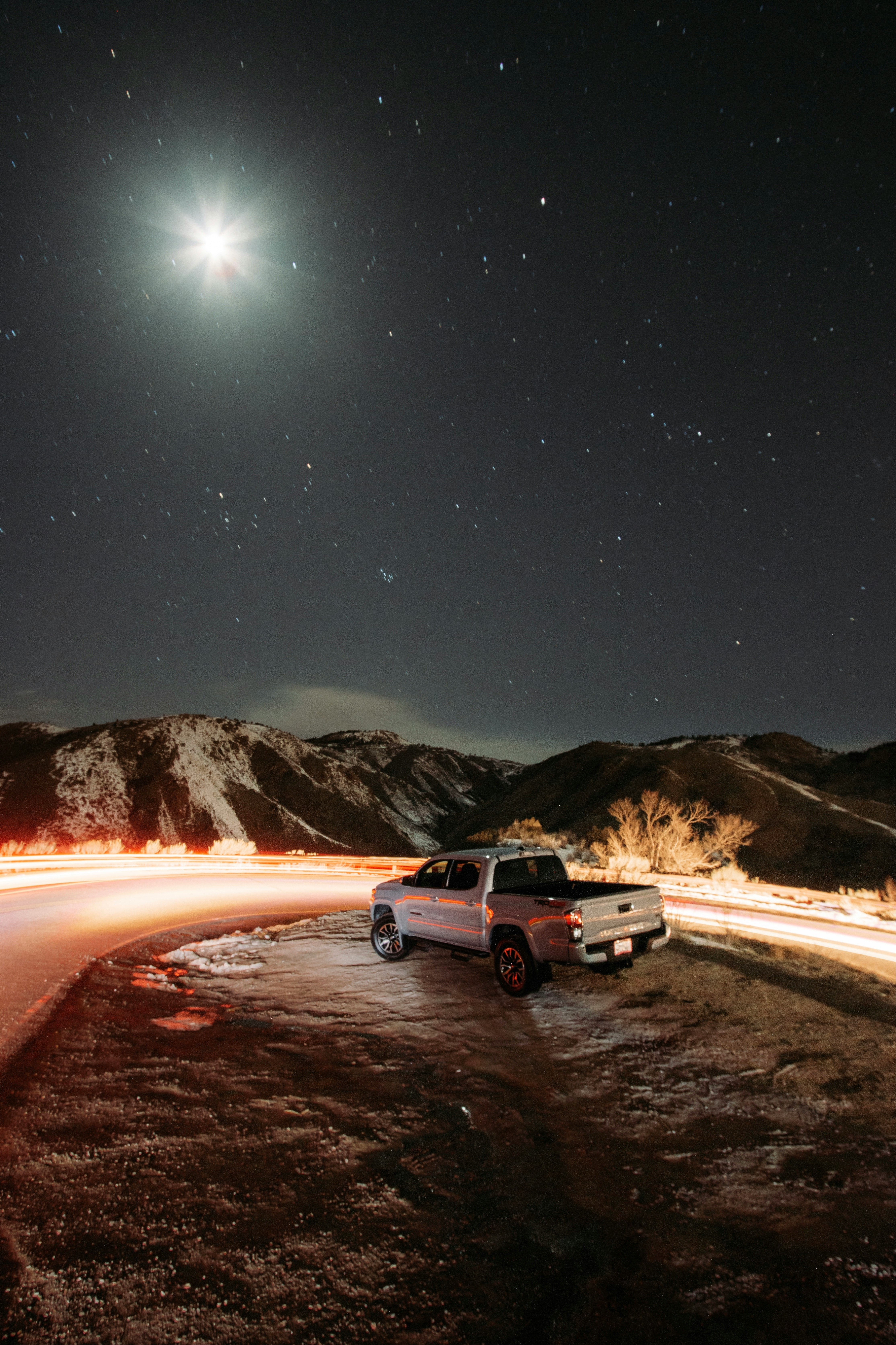 white suv on road during night time